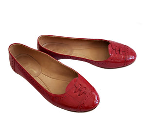 Perforated flats hot sale women's shoes